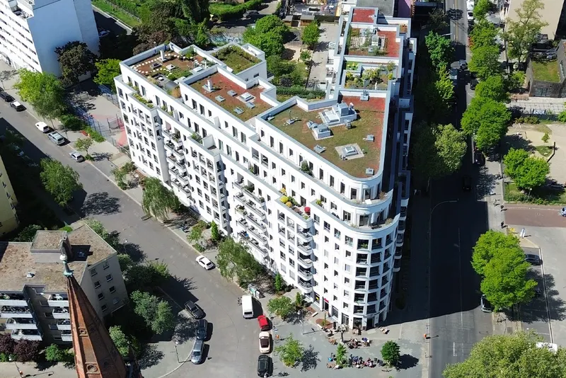 Aerial view of a modern residential building with roof terraces on Else-Lasker-Schüler-Straße, Berlin
